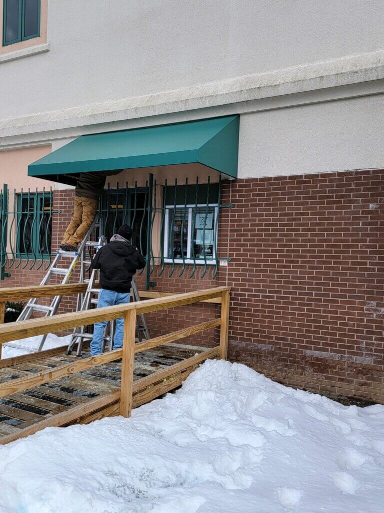 awning being installed