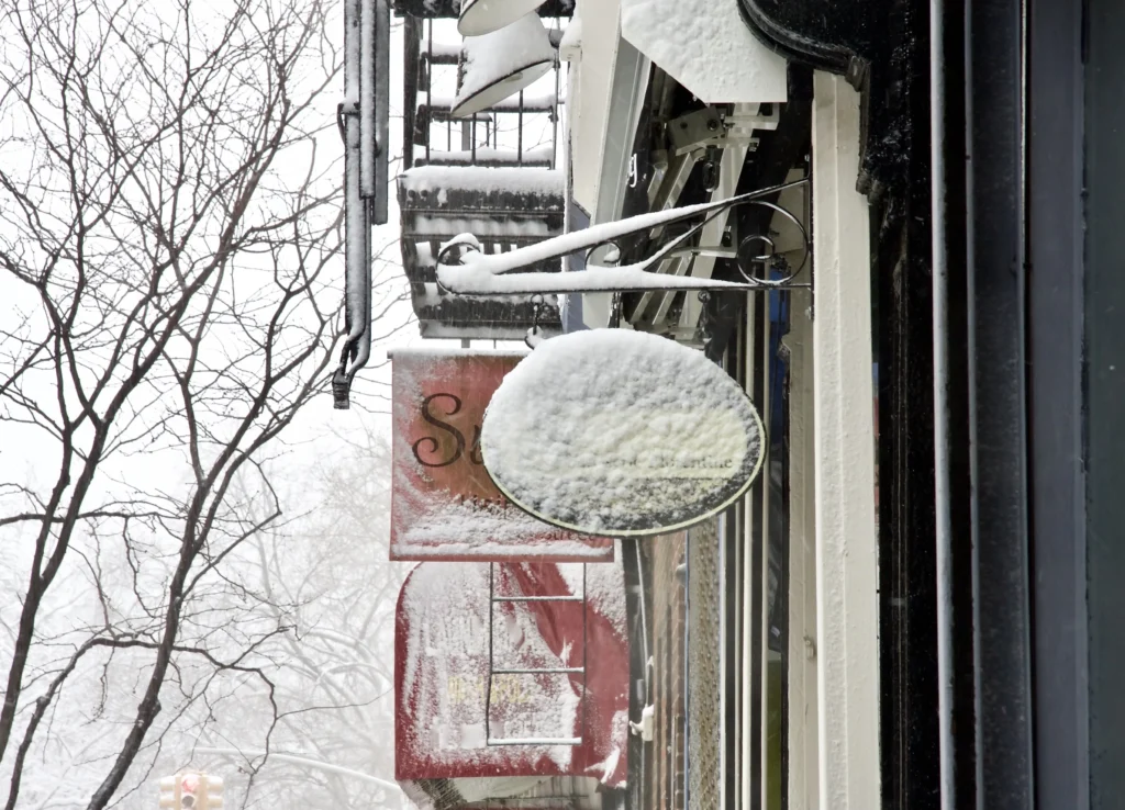 snow covered sign
